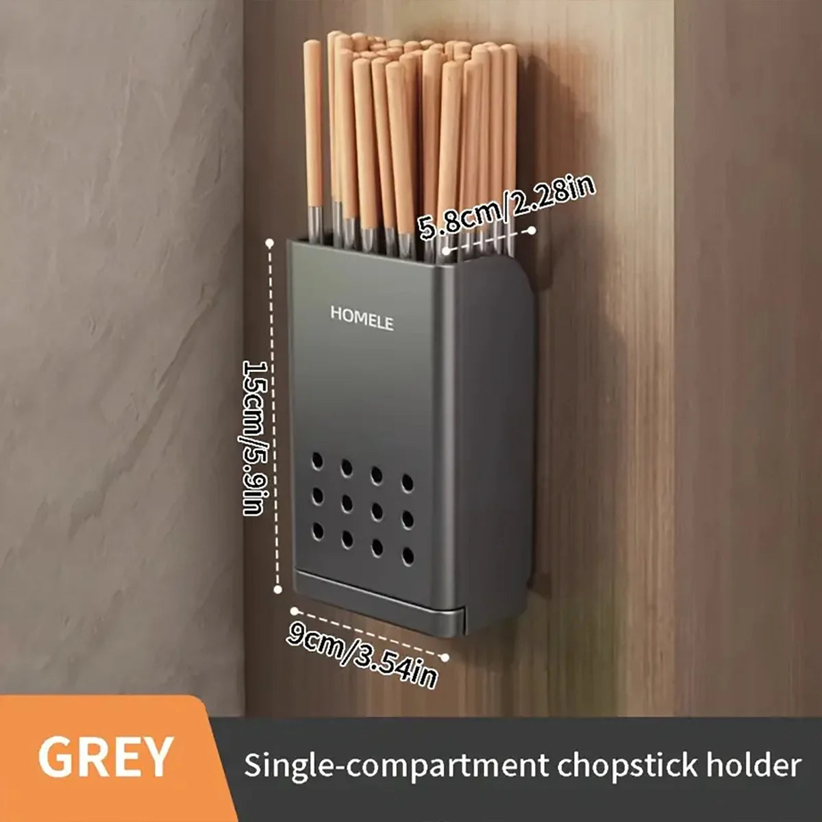 A grey single-compartment chopstick holder mounted on a wooden surface.