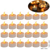 A set of romantic LED heart tea lights with artificial rose petals displayed on a dark surface.