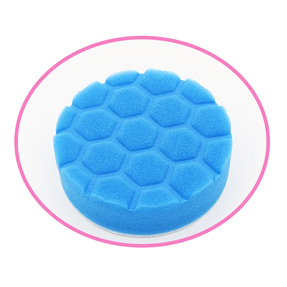 A blue foam cleaning brush head set with sponge, scouring pad, and polishing disc shown in a circular view.