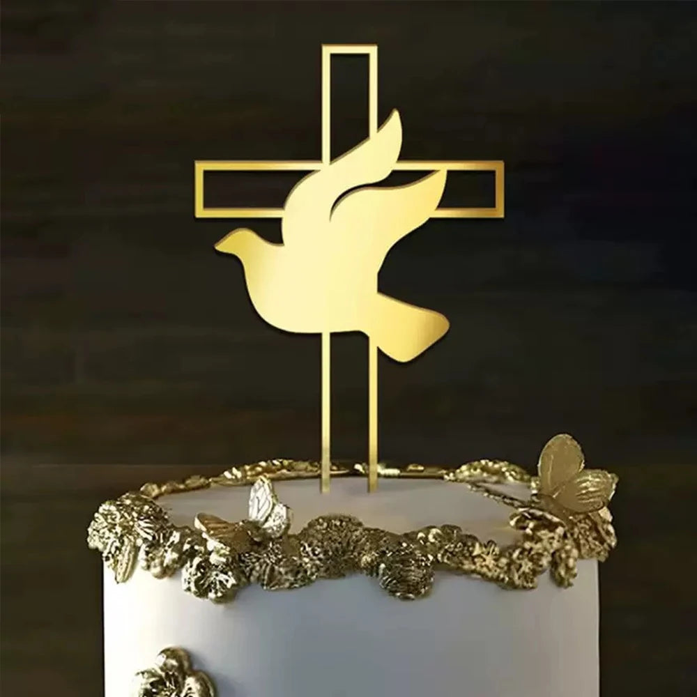 Gold acrylic cross cake topper featuring a dove design on top of a white cake.