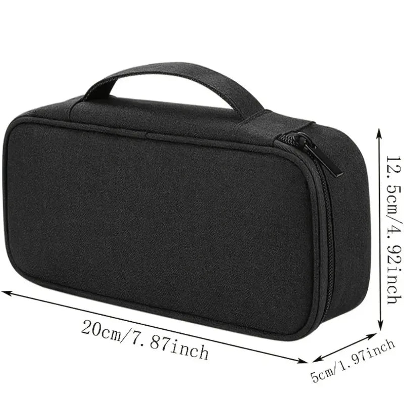 Black multi-purpose travel electronics organizer bag with a zippered closure and carrying handle.