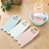 Three pastel-colored thickened washboards for delicate laundry displayed on a wooden floor.