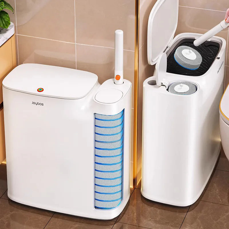 A white Joybos 2-in-1 trash can with an attached toilet brush is shown standing on a tiled surface.
