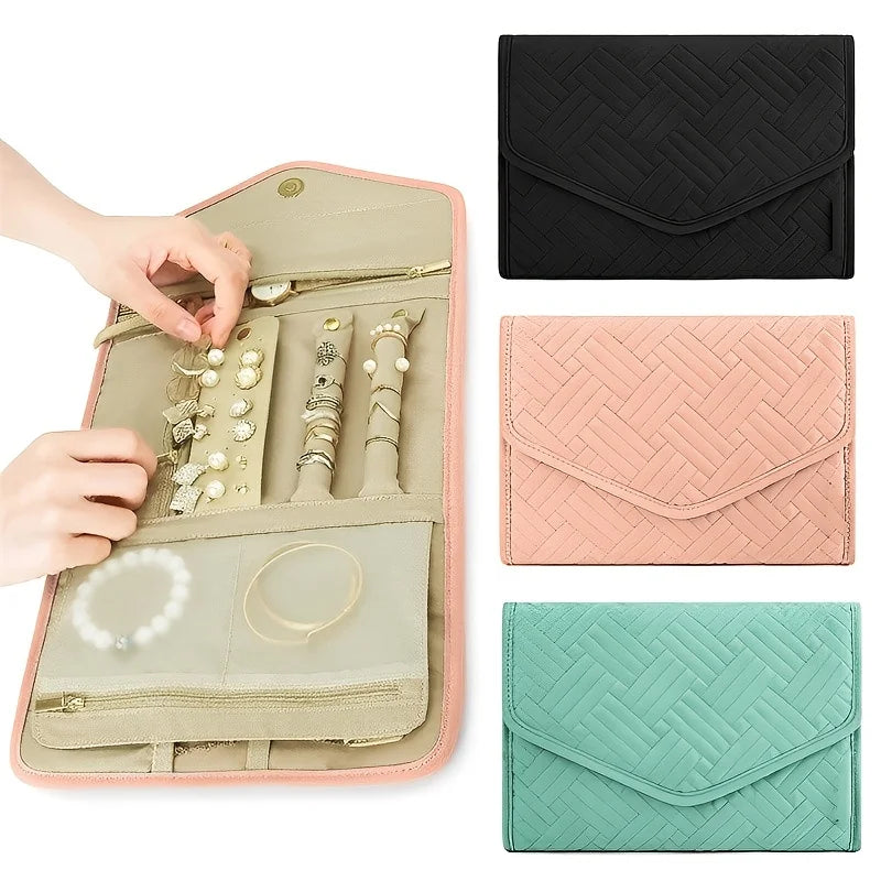 A foldable waterproof jewelry organizer bag shown open with various jewelry pieces and accessories displayed inside.
