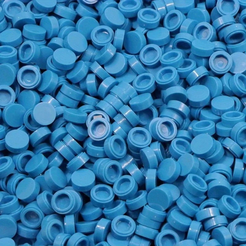 A pile of round blue building blocks used for DIY projects.