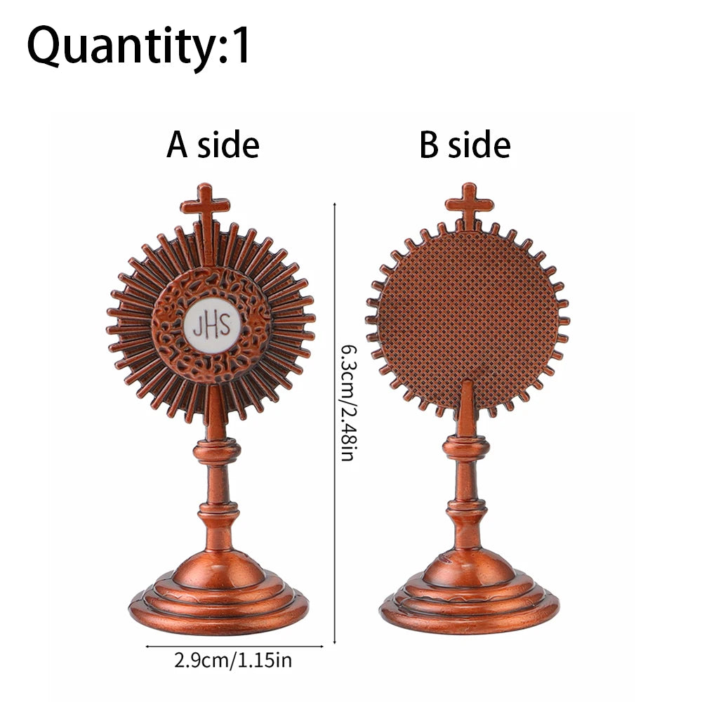 A side and B side views of a mini metal religious ornament with a cross design.