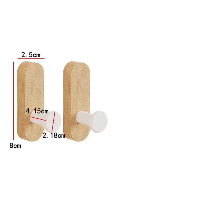 Two natural wood wall hooks with white mounting pieces shown with dimension lines.