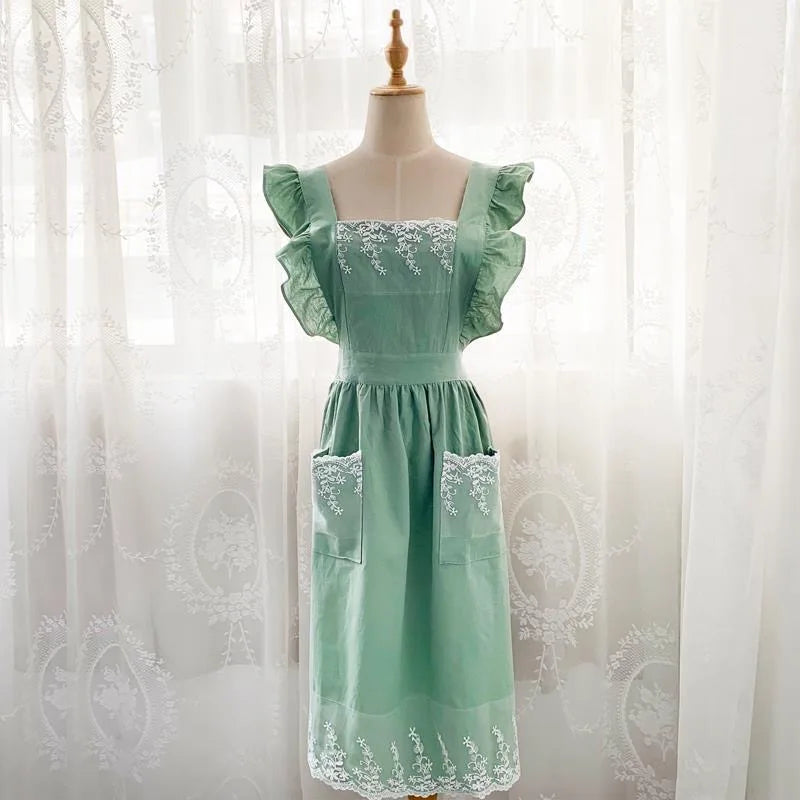 Mint green lace detail cotton linen kitchen apron displayed on a mannequin.