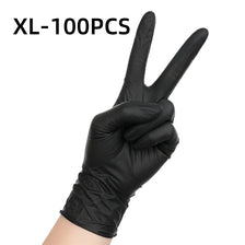 A hand wearing black nitrile disposable gloves making a peace sign gesture.