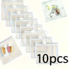 A collection of clear, resealable plastic organizer bags for travel medicine, showing various compartments and contents.