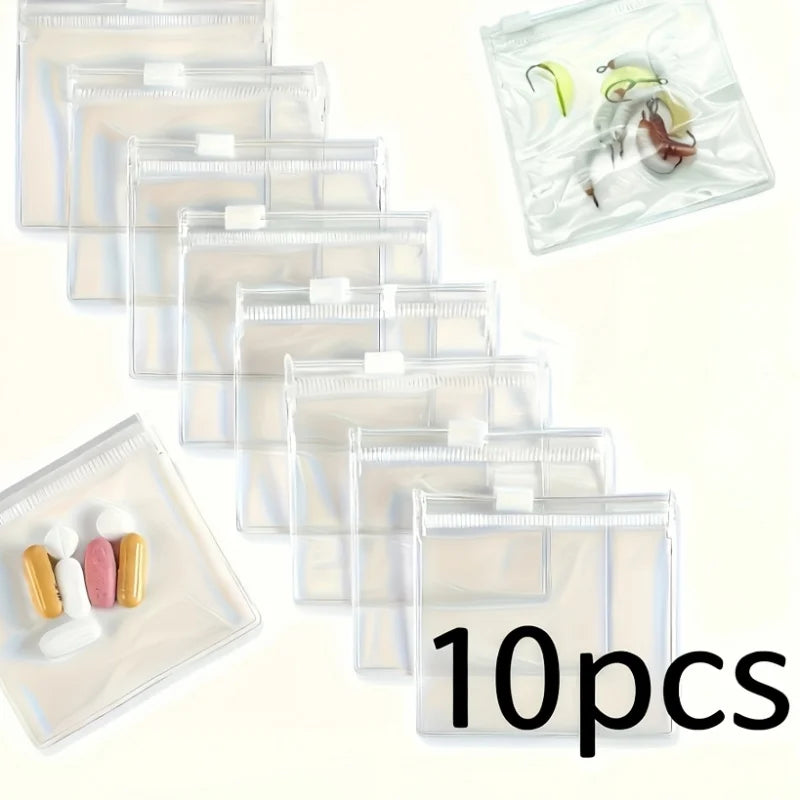 A collection of clear, resealable plastic organizer bags for travel medicine, showing various compartments and contents.