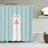 Light blue shower curtain featuring a pink paw print design for pets