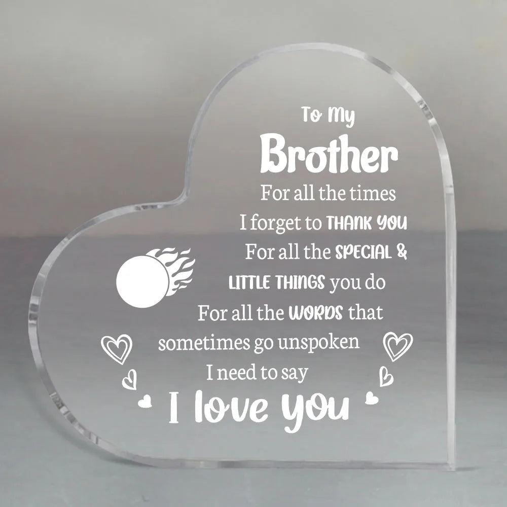 A clear acrylic heart engraved with the message I love you to my brother