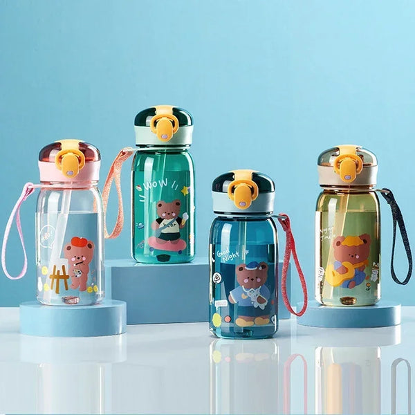 A set of four cute cartoon sippy cups with straws featuring bears and other characters in various colors