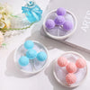 A collection of purple and light blue floating pet hair remover tools displayed on a white surface.