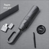 A fog gray large automatic folding umbrella with a handle and a separate carrying case is shown on a gray surface.