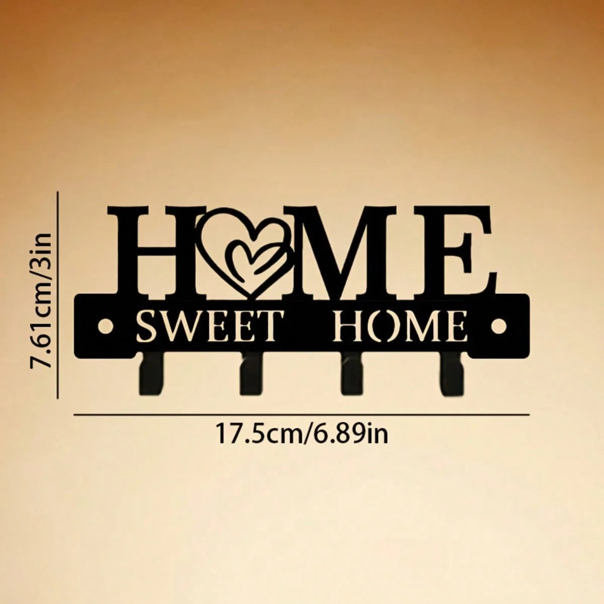 Black rustic metal wall hook key holder with the text HOME SWEET HOME engraved on it.