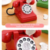 A red retro telephone toy with an angel pattern, used as a simulation phone shape for children.