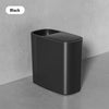 A sleek black odor-sealing trash can with a press lid, shown standing on a gray surface.