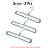 Three green space-saving clothes organizer hangers with hooks
