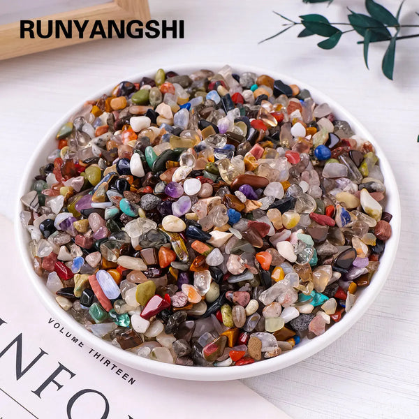 A bowl filled with various natural crystal gravel and stones for decor and spirituality.
