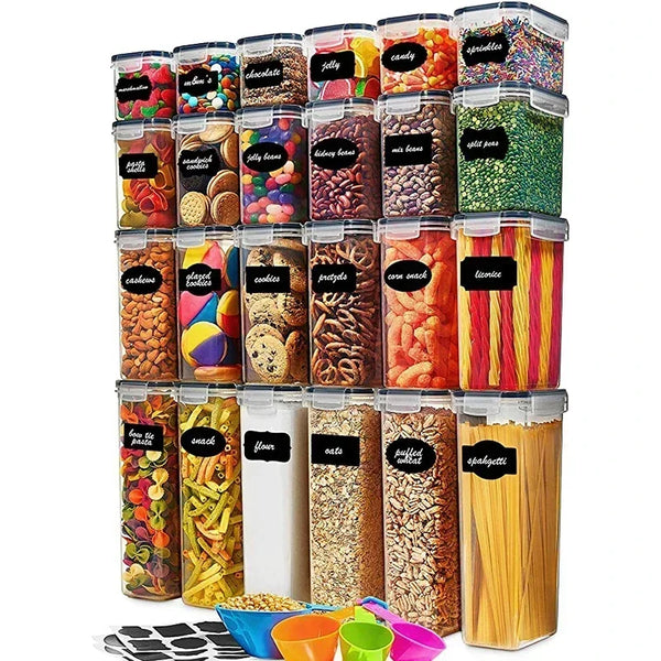 A set of five clear food storage containers with lids filled with various colorful grains and seeds.