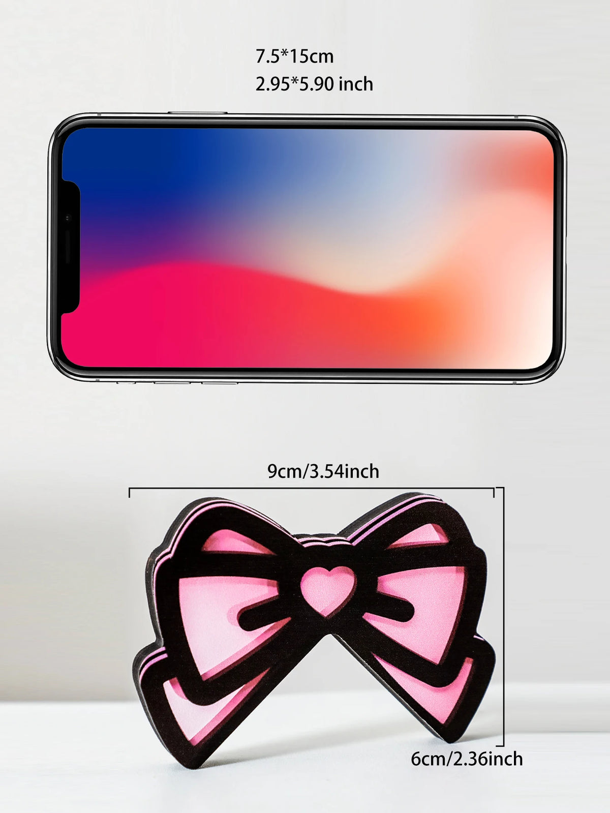 Un écouteur pour oreilles de chat en nœud rose décoratif, à côté d'un smartphone affichant un fond dégradé.