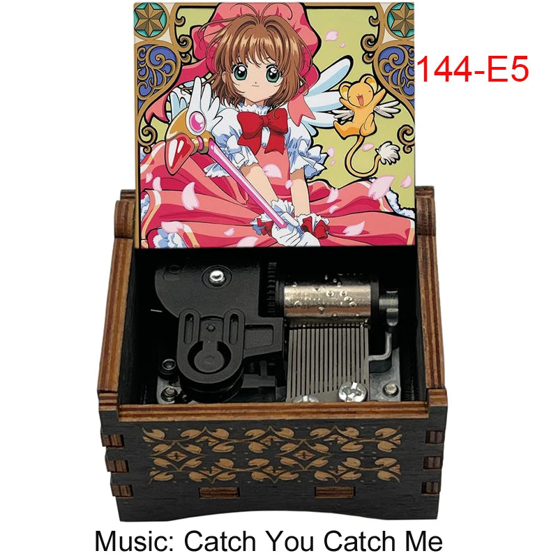 A wooden box containing a musical tone box and an anime-style card featuring a character.