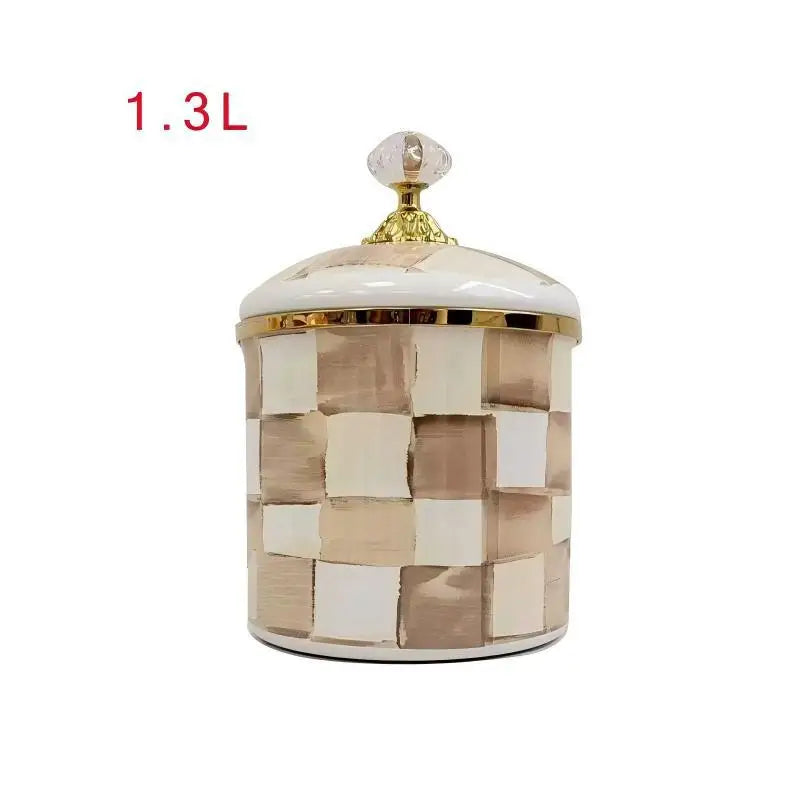 A square storage jar with a lid featuring a beige and white checkered pattern and gold accents.