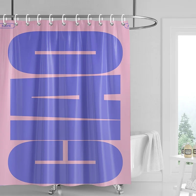 A purple shower curtain featuring abstract geometric art in pink tones hanging from a metal rod.