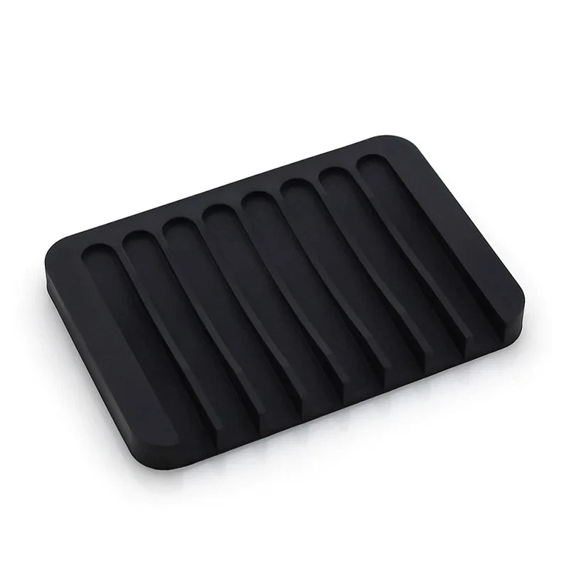 Black self-draining silicone soap dish with an anti-slip base