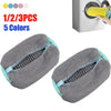 Three reusable shoe washing bags in gray and blue colors are shown next to a washing machine.