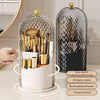 A clear glass organizer for makeup brushes featuring a lid, designed for 360-degree rotation and compartmentalized storage.