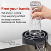 A hand is pouring water into a glass rinser, which is placed on a controlled firing base for high-pressure washing.