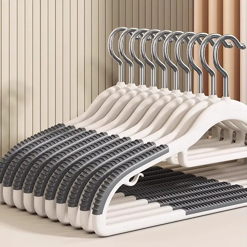 A display of white and gray non-slip heavy-duty plastic hangers with 360 degree swivel hooks.