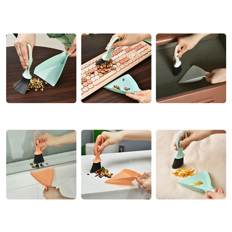 A set of mini brooms and dustpans in various colors cleaning a desk and keyboard.