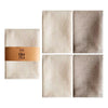 A set of four absorbent 100% cotton waffle weave towels in beige and brown tones.
