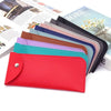 A stack of PU leather eyewear cases in various colors, including red, pink, blue, and purple.