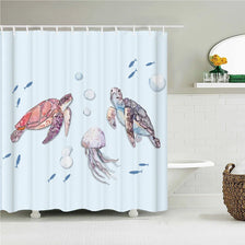 A watercolor illustration of sea turtles and fish on a light blue shower curtain.