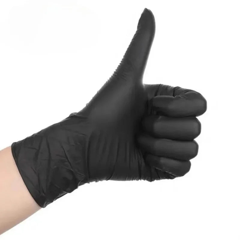 A hand wearing a black disposable nitrile glove making a thumbs up gesture.
