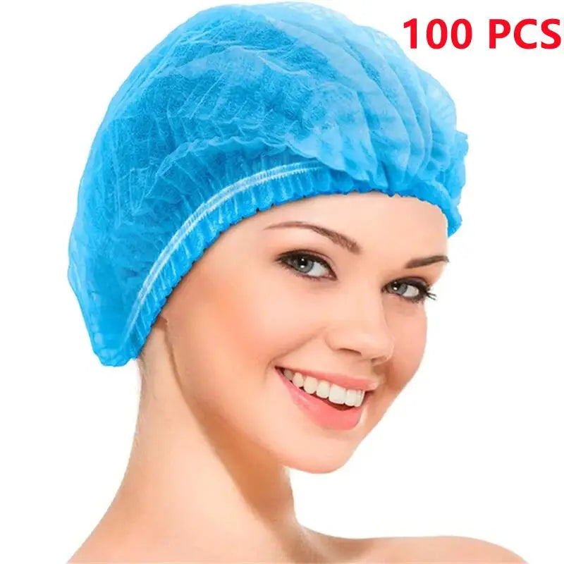 A woman is wearing a light blue disposable bouffant hair net cover.