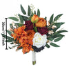 An elegant artificial rose wedding bouquet featuring orange, deep red, and cream roses with green foliage.