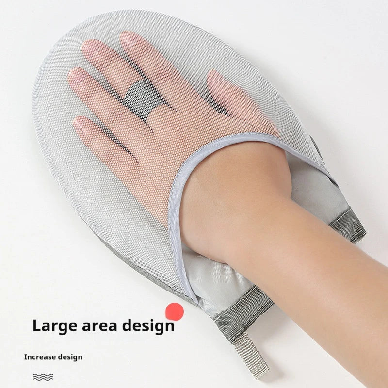 A hand is placed on a large, gray mesh ironing board or glove with a light gray strap.
