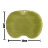 A light green reusable silicone foot scrub brush with a contoured shape and a hole for drainage.