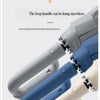 A close-up view of a large automatic folding umbrella in various colors, showing the loop handle design.