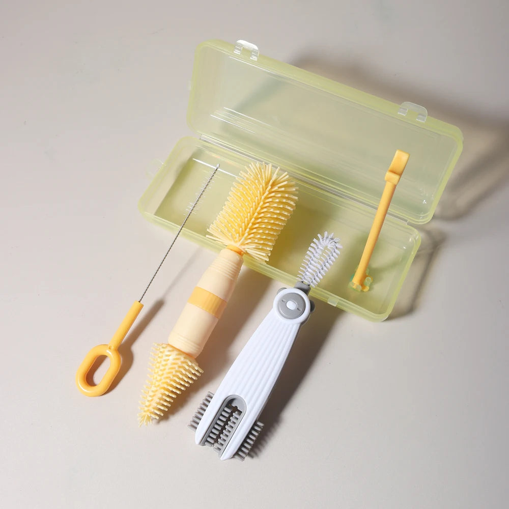 A silicone baby bottle cleaning set with a clear plastic case containing a brush and a cleaning tool.