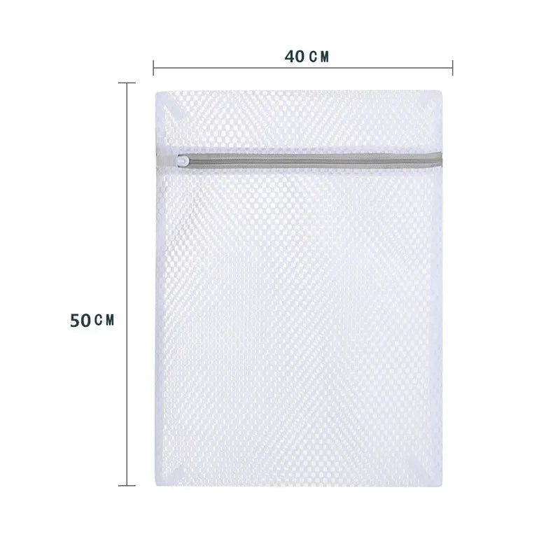 A white reusable honeycomb mesh laundry bag with a silver zipper, shown flat.