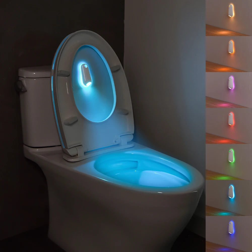 A white toilet with a glowing blue light feature on the seat and a vertical strip of lights on the side.