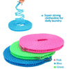 A set of pink, blue, and green portable windproof clothesline rolls for daily laundry.