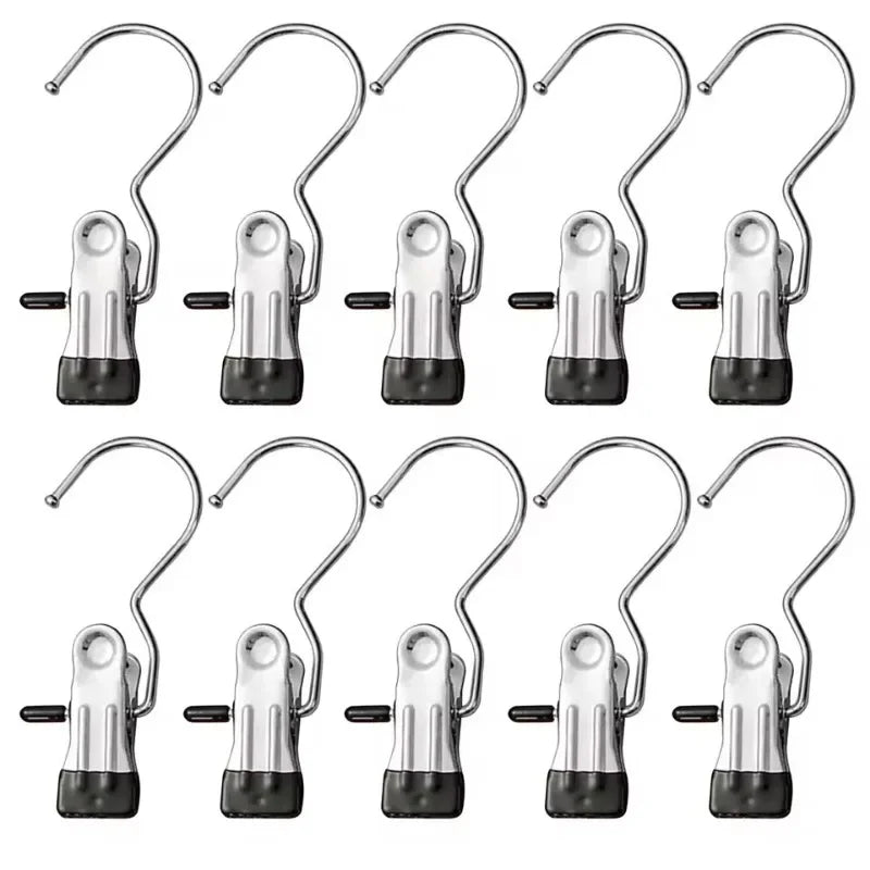A set of stainless steel clothespins for laundry and organization.